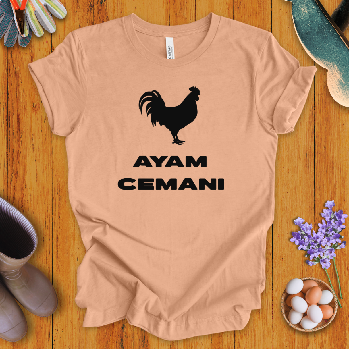 Black Ayam Cemani chicken silhouette on t-shirt with bold text “AYAM CEMANI”