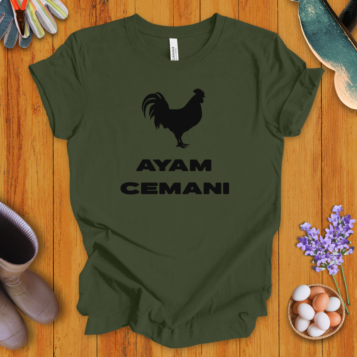 Black Ayam Cemani chicken silhouette on t-shirt with bold text “AYAM CEMANI”