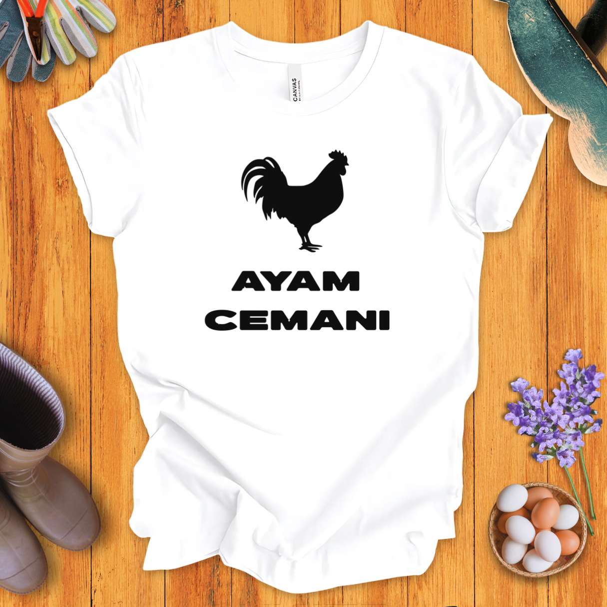 Black Ayam Cemani chicken silhouette on t-shirt with bold text “AYAM CEMANI”