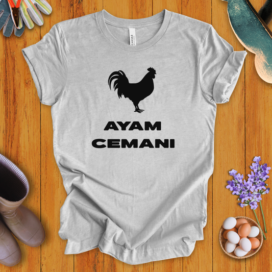 Black Ayam Cemani chicken silhouette on t-shirt with bold text “AYAM CEMANI”